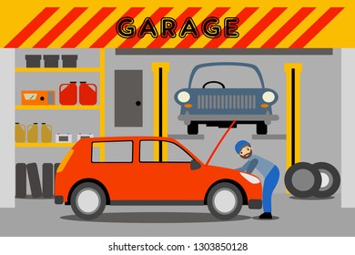 a young mechanic repairs a red car in the garage