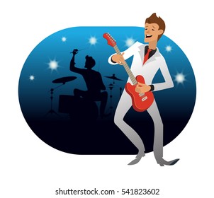 Young men in a light suit, dark shirt and red tie is playing on a red electric guitar and smiling.