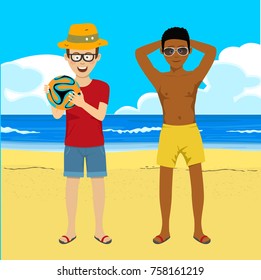 Young men posing with soccer ball on summer tropical beach