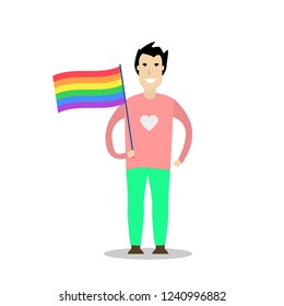 Young men wearing a rainbow t shirt and holding a rainbow flag. Celebrating gay people rights