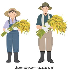 Young men and women standing side by side holding a rice bundle