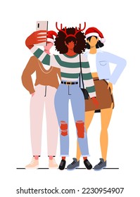 Young modern girls and a guy in casual clothes and new year hats take a front camera selfie. A group of young people celebrate the new year.