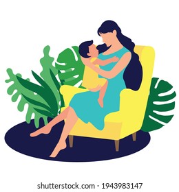 A young mother with a baby in her arms sits in a chair. Motherhood. Staying at home mom. A housewife. Natural background with leaves monstera and plants.