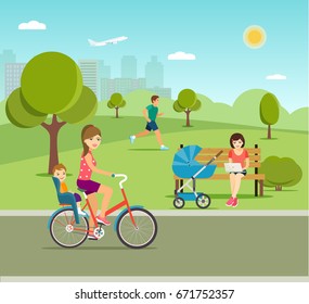 Young mother relaxing on bench with laptop and stroller, Man runner outside jogging, woman and kid on bicycle with child seat  at park.