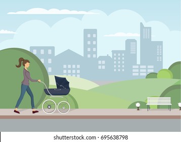 Young mother walking with baby carriage. The pleasant walking with little child. The pram for walking with baby on the open air. Little kid on a walk with mother.