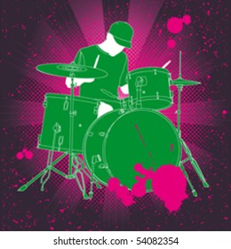 A young musician and his drum kit.