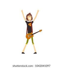 Young musician standing with guitar and showing rock sign. Rocker on stage. Guy with brown hair in green shorts and black t-shirt with skull print. Flat vector design