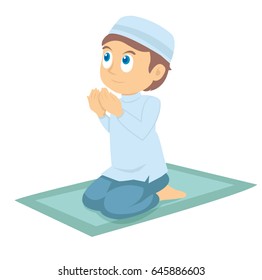A young muslim boy praying