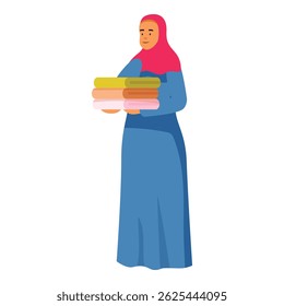 Young muslim woman carrying clean folded clothes, enjoying fresh laundry scent, domestic chores, and household duties