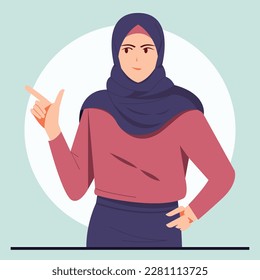 Young muslim woman wearing hijab pointing finger