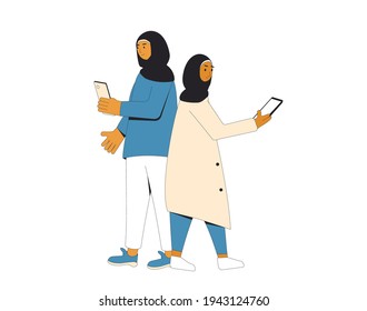 Young muslim women standing back to back. Female teenagers  wearing in hijab and casual clothes  using their phones isolated on a white background. Vector color line illustration. 