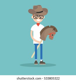 Young nerd wearing cowboy hat and riding hobbyhorse / flat editable vector illustration