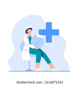 A young nurse with a big pill. The character of a female doctor in full growth. Vector flat illustration for the clinic's website, applications.