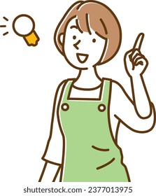 A young nursery teacher woman in an apron who came up with a good idea