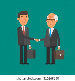 Young And Old Businessman Shake Hands