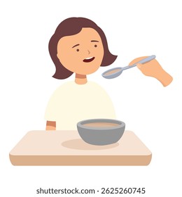 Young patient is being fed a spoonful of food by a nurse while sitting at a table