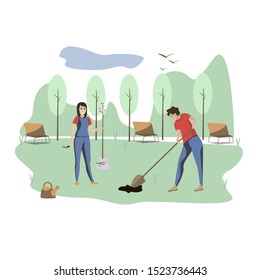 Young people plant trees in city garden. Volunteers.