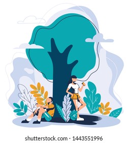 young people relax in nature, sit and stand near a tree, drink coffee
