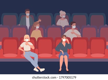 Young People sitting in the cinema in protective masks observe social distance