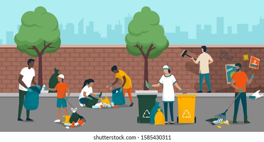 Young people volunteering and cleaning up the city street, they are collecting waste, removing dirt from a wall and separating garbage into different trash bins, environmental care concept