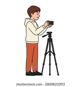 Young photographer setting up camera on tripod. A boy wearing hoodie and taking photos or video. Flat vector modern illustration.