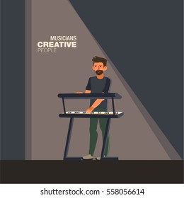 Young pianist of rock band playing keyboard. Creative people