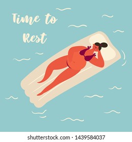 A young pregnant woman in a swimsuit relaxing while swimming on an inflatable mattress at sea with text time to rest. Smiling pregnant woman swaying on the waves