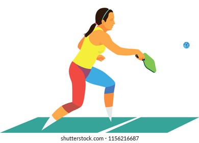 young pretty active girl in a yellow T-shirt playing pickleball with a partner on the tennis court