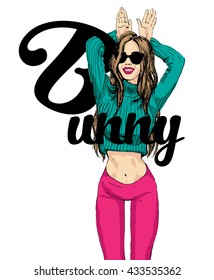 Young pretty hipster girl imitating bunny ears by her hands