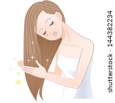 Young pretty woman stroking her shiny long hair.