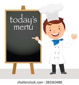 Young professional chef man. Male chef writing on the wooden board.