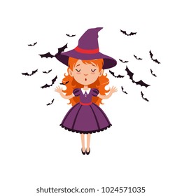 Young red-haired girl witch standing with hands up and wearing purple dress and hat. Kid character in Halloween costume surrounded with black bats. Flat cartoon vector