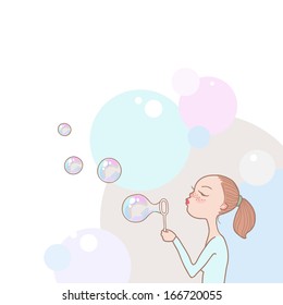 Young redhead girl blowing soap bubbles 