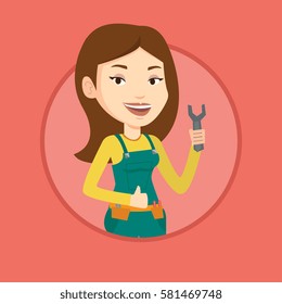 Young repairman standing with spanner in hand. Caucasian female repairman giving thumb up. Repairman in overalls holding a spanner. Vector flat design illustration in the circle isolated on background