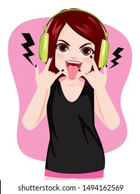 Young rock girl making horns hand gesture showing tongue while listening to music with headphones