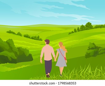 Young romantic couple walks in park or field. Grass in the foreground, bushes, thickets, valley. Walking the countryside, tourist route, picturesque landscape with young married couple or teenagers