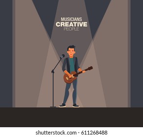 A young singer man playing guitar. Creative people 