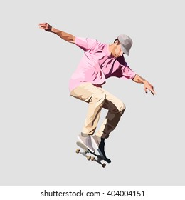 Young skateboarder attempting a trick with his skate