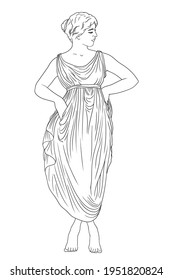 A young slender woman in a dress is standing on her toes and dancing.