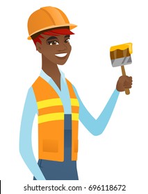 Young smiling african-american house painter in hard hat holding a paintbrush. Concept of house renovation. Vector flat design illustration isolated on white background.