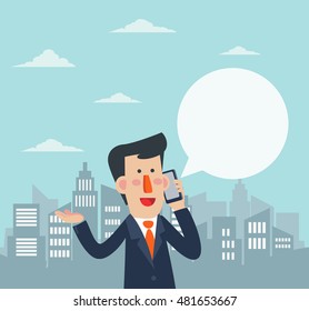 Young smiling business man talking on her phone in a city street