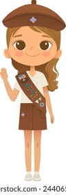 Young smiling girl scout wearing sash with badges isolated on white background. Female scouter, Brownie ligue Scout Girls troop