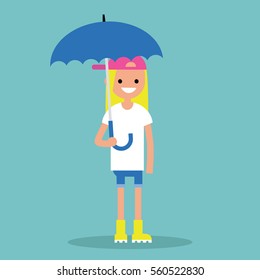 Young smiling girl with umbrella wearing yellow rubber boots / flat editable vector illustration, clip art