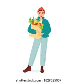 Young smiling woman stands with a paper grocery bag with fresh vegetables and fruits. Vegetarian, vegan products. Healthy organic vitamin food, modern youth lifestyle. Isolated vector illustration