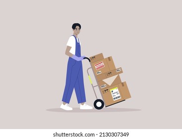 A young storage worker in denim overalls rolling a cart loaded with cardboard boxes, delivery service, cargo shipment