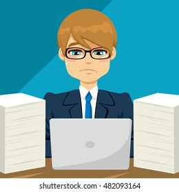 Young stressed businessman working hard surrounded with paper documents and laptop
