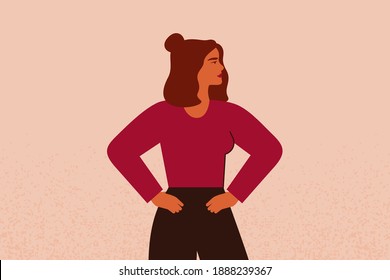 Young strong female with hands on her hips looks forward. Confident Businesswoman or entrepreneur in corporate clothing. The concept of gender equality and of the female empowerment movement.