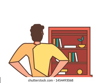 young strong man with library shelving
