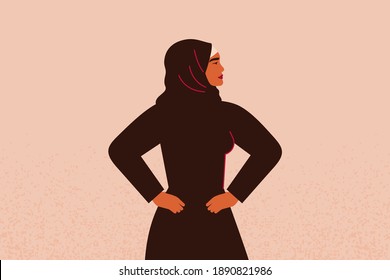 Young strong muslim female with hands on her hips looks forward. Confident Arabian Businesswoman or entrepreneur in abaya. Concept of gender equality and of the female empowerment movement.