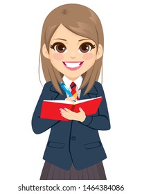 Young student girl in school uniform standing writing on notebook book